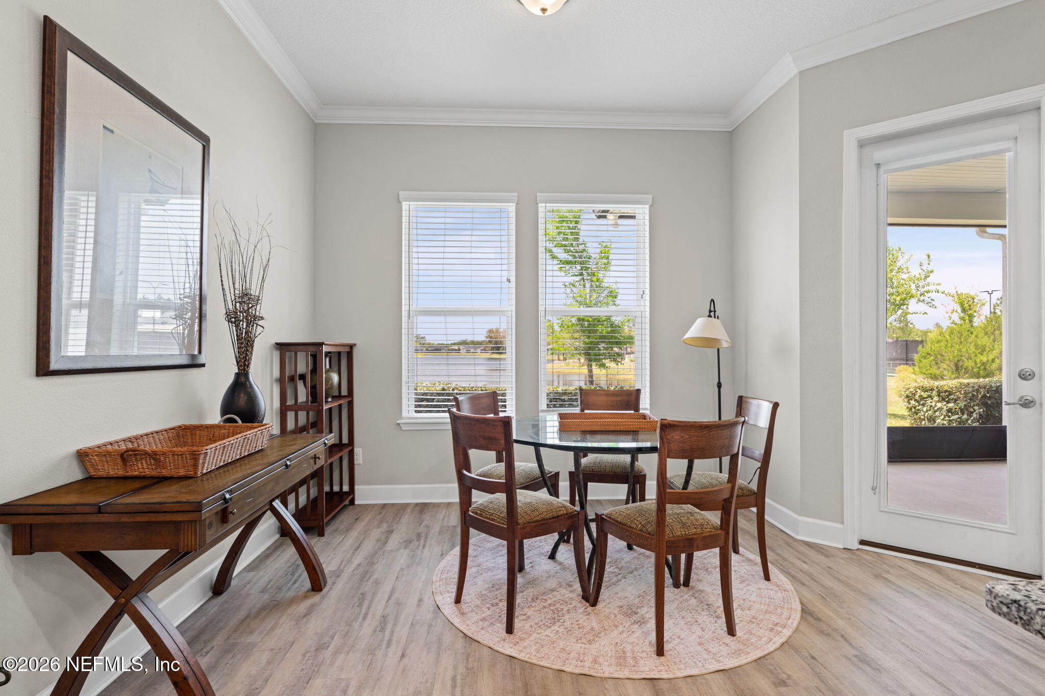 813 Rustic Mill Dr Street St. Augustine, FL 32092 - Photo 21 of 57 a view of a dining room with furniture window and wooden floor