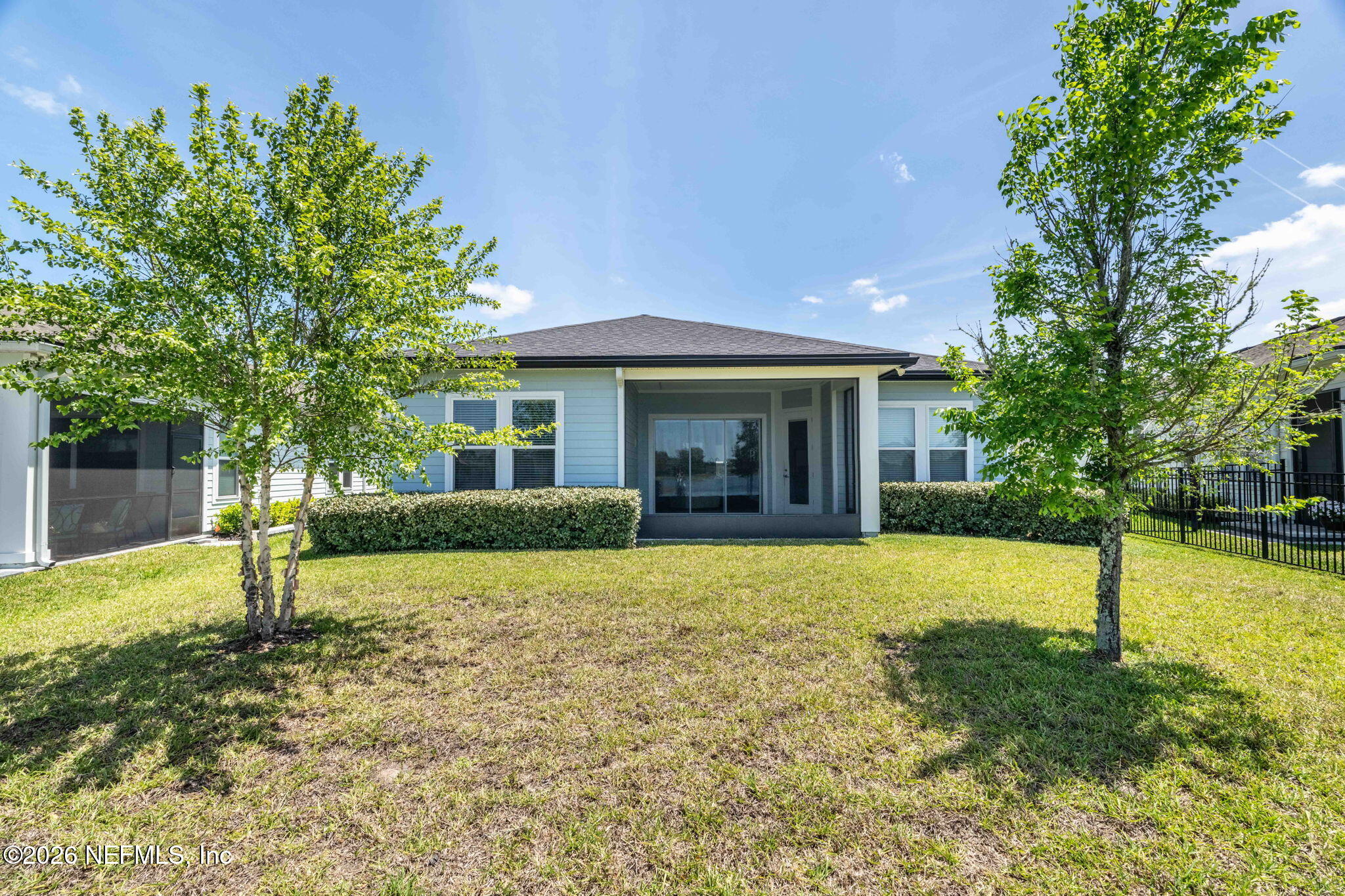 813 Rustic Mill Dr Street St. Augustine, FL 32092 - Photo 30 of 57 a front view of house with yard and trees