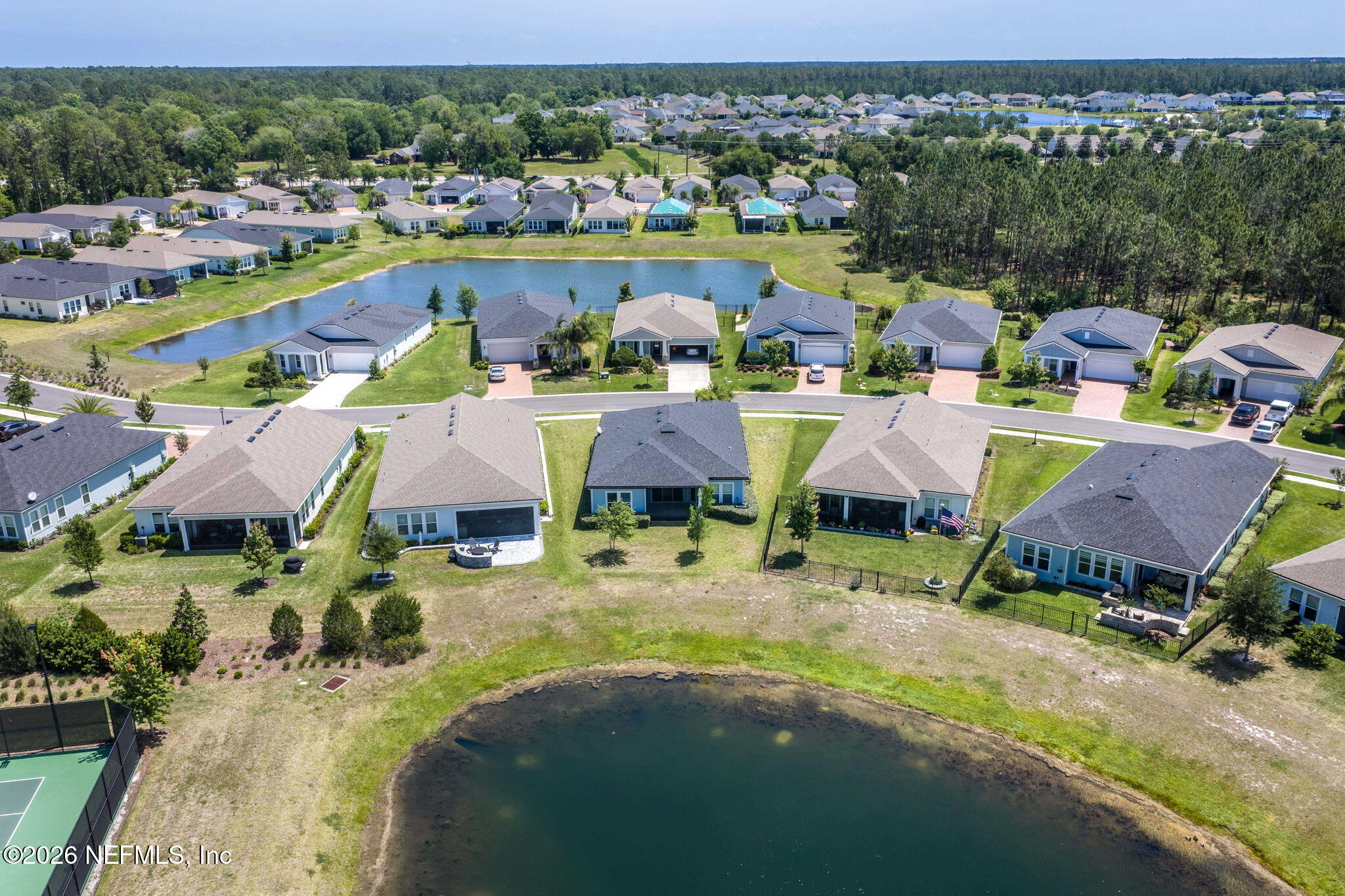 813 Rustic Mill Dr Street St. Augustine, FL 32092 - Photo 34 of 57 an aerial view of residential houses with outdoor space and swimming pool
