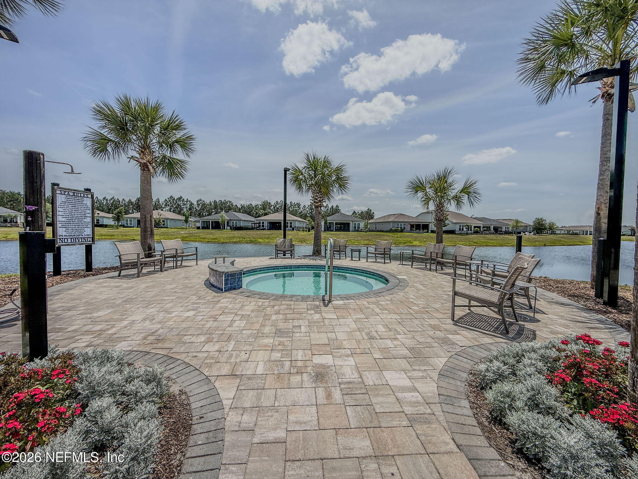 813 Rustic Mill Dr Street St. Augustine, FL 32092 - Photo 55 of 57 a view of a swimming pool with a garden and seating area