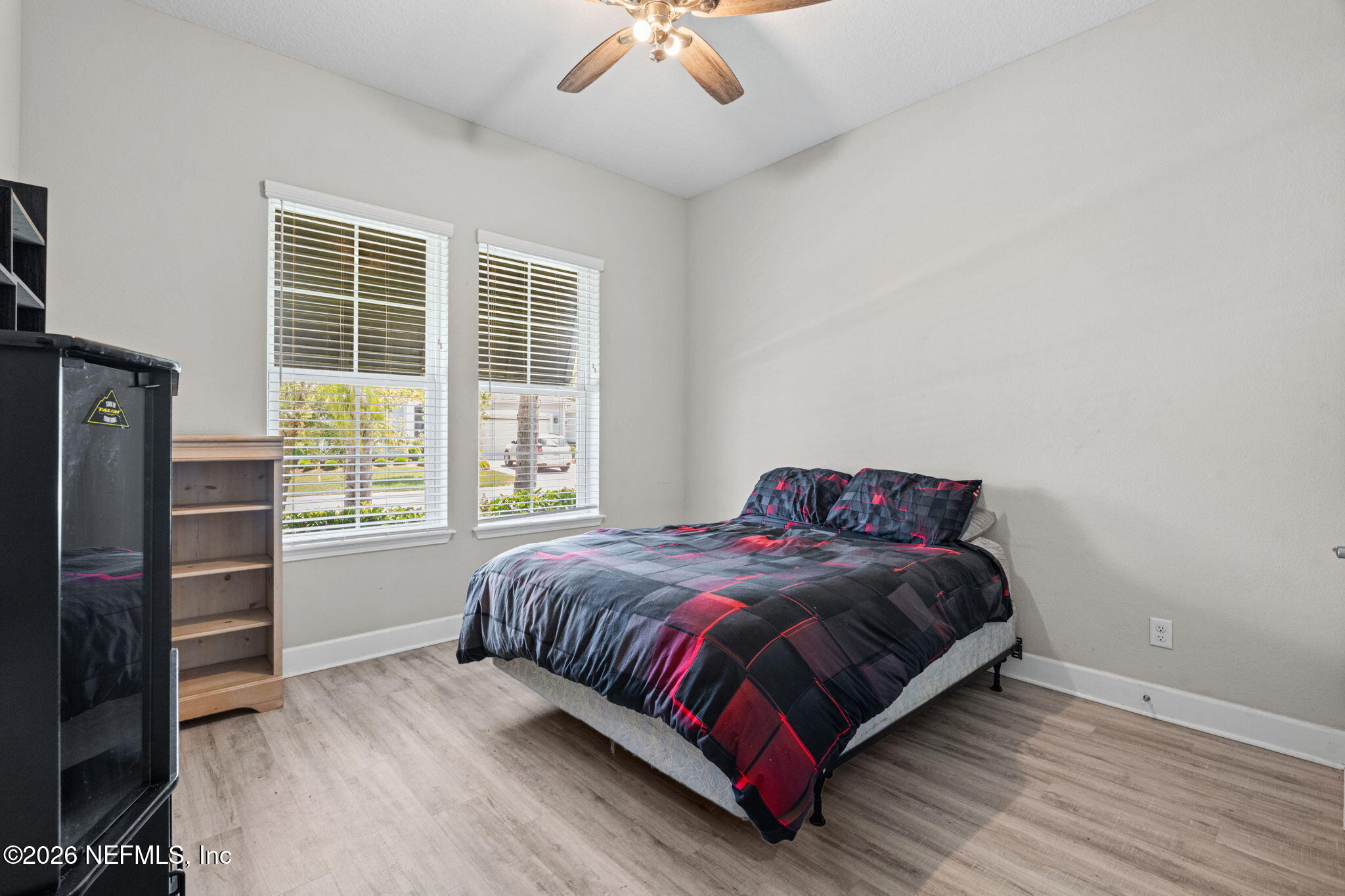 813 Rustic Mill Dr Street St. Augustine, FL 32092 - Photo 8 of 57 a bedroom with a bed and a chandelier