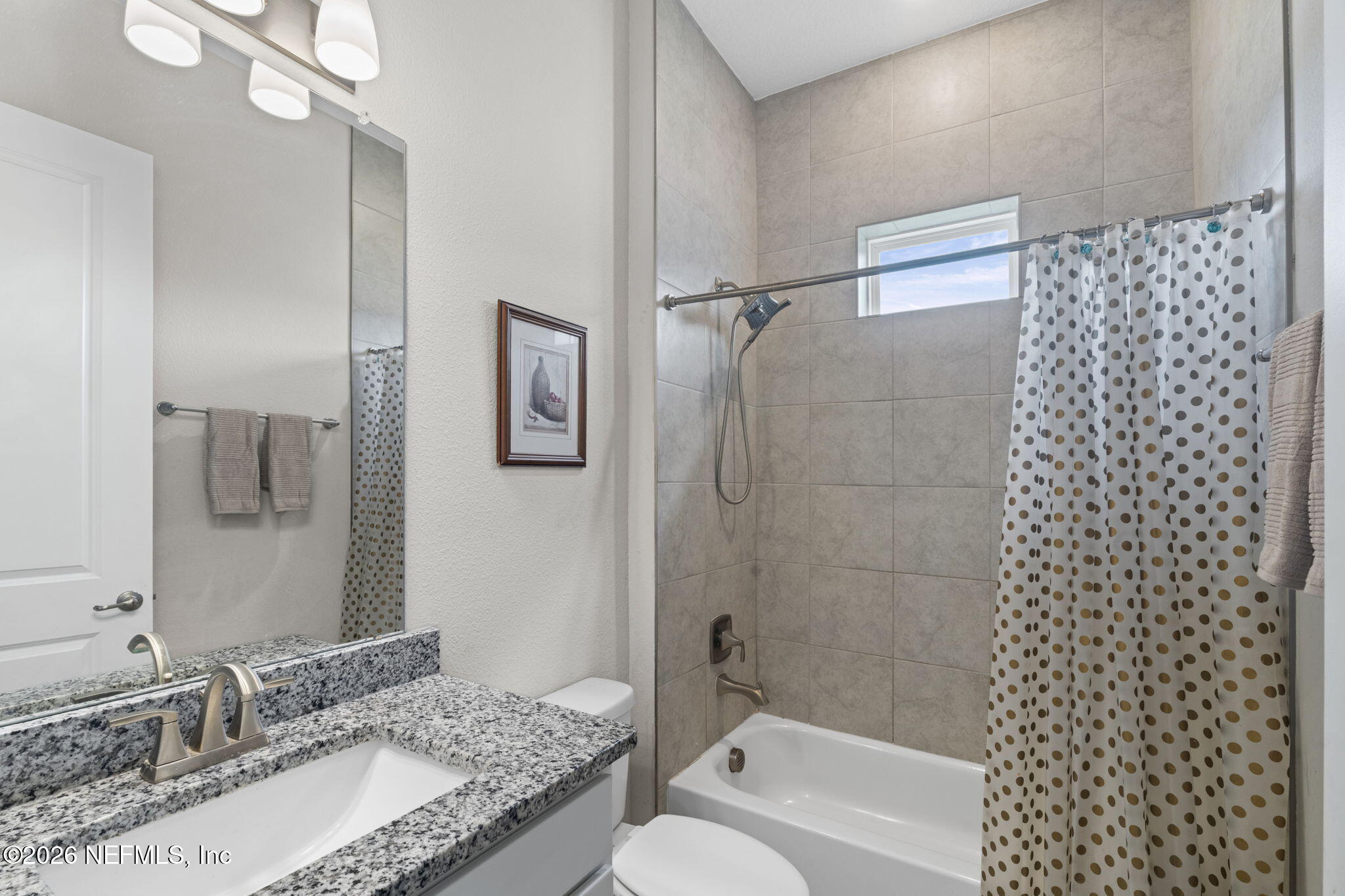 813 Rustic Mill Dr Street St. Augustine, FL 32092 - Photo 9 of 57 a bathroom with a granite countertop sink toilet and shower