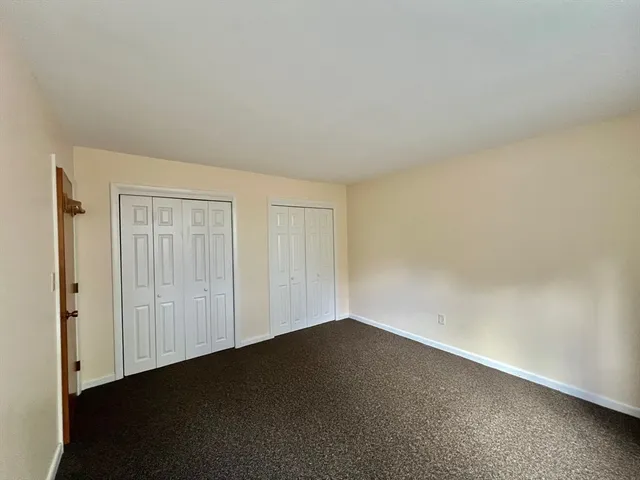 an empty room with a empty space and a window