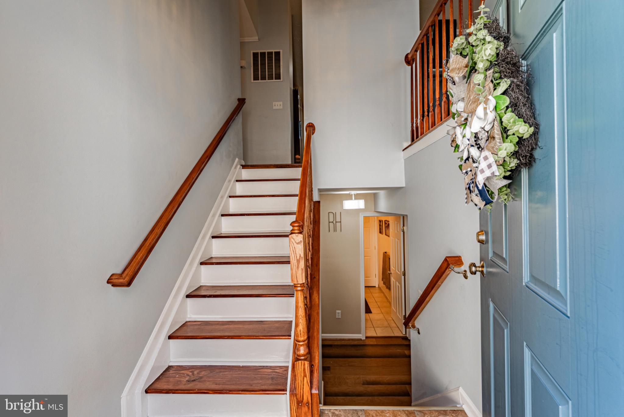 60 6 Point Court Baltimore, MD 21244 - Photo 5 of 28 a view of entryway with wooden floor and stairs