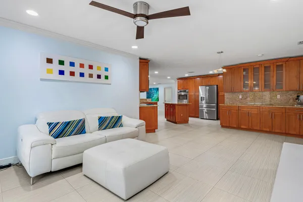 a kitchen with stainless steel appliances granite countertop a stove refrigerator sink and cabinets