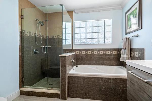 a bathroom with a bathtub and a sink