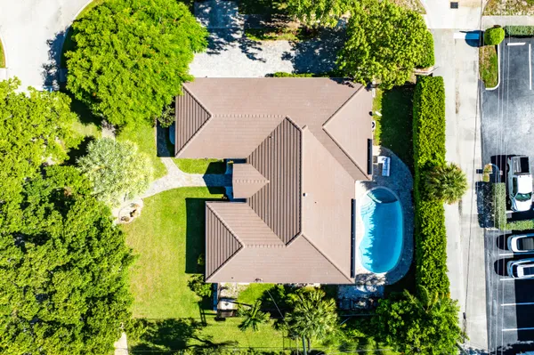 an aerial view of houses with yard