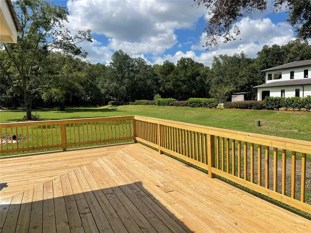 a view of deck with a yard
