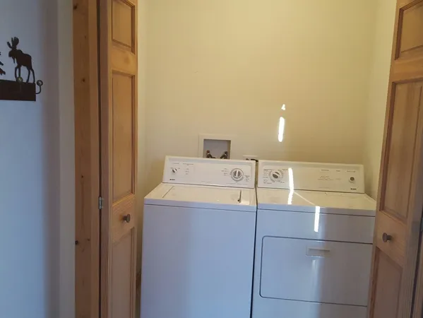 a bathroom with a mirror and vanity