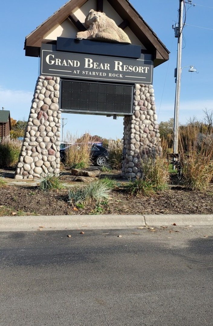 2643 North Illinois Rt 178 Road, Unit I4 Utica, IL 61373 - Photo 23 of 23 a front view of a house with a yard and garage