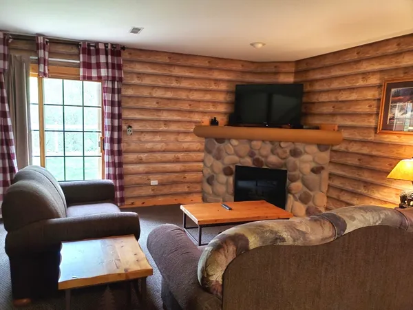 a bedroom with furniture and a fireplace