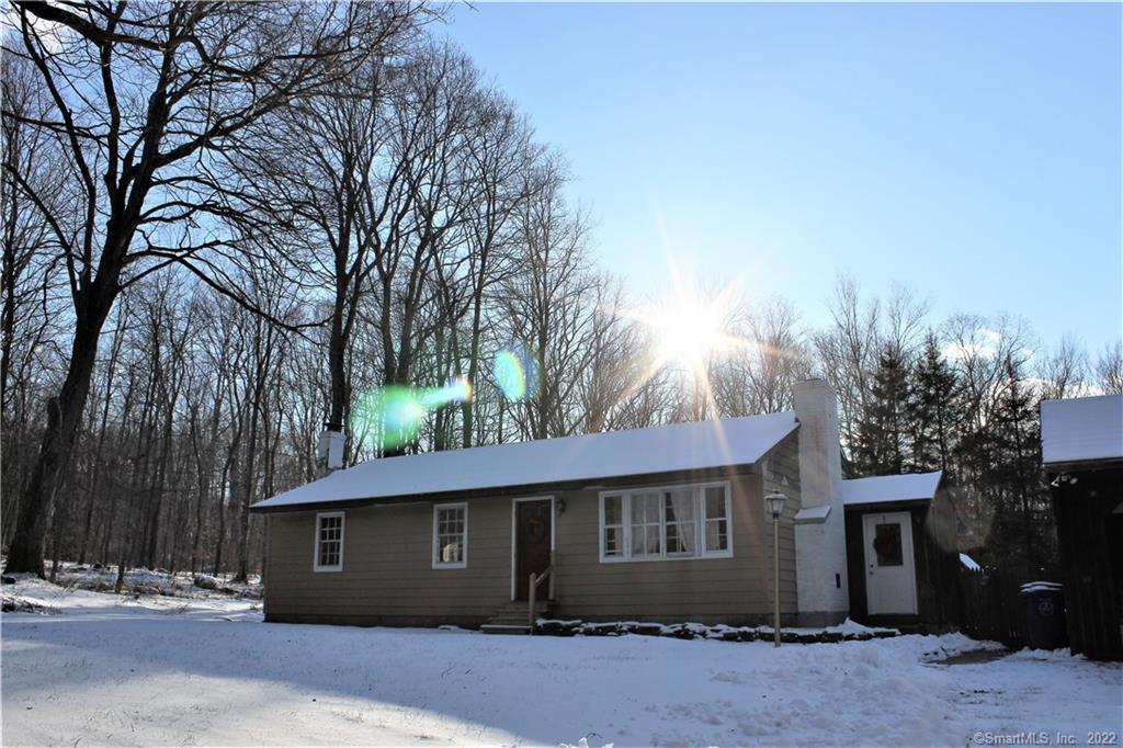 207 England Road Chaplin, CT 06235 - Photo 1 of 1 a front view of a house with a garden