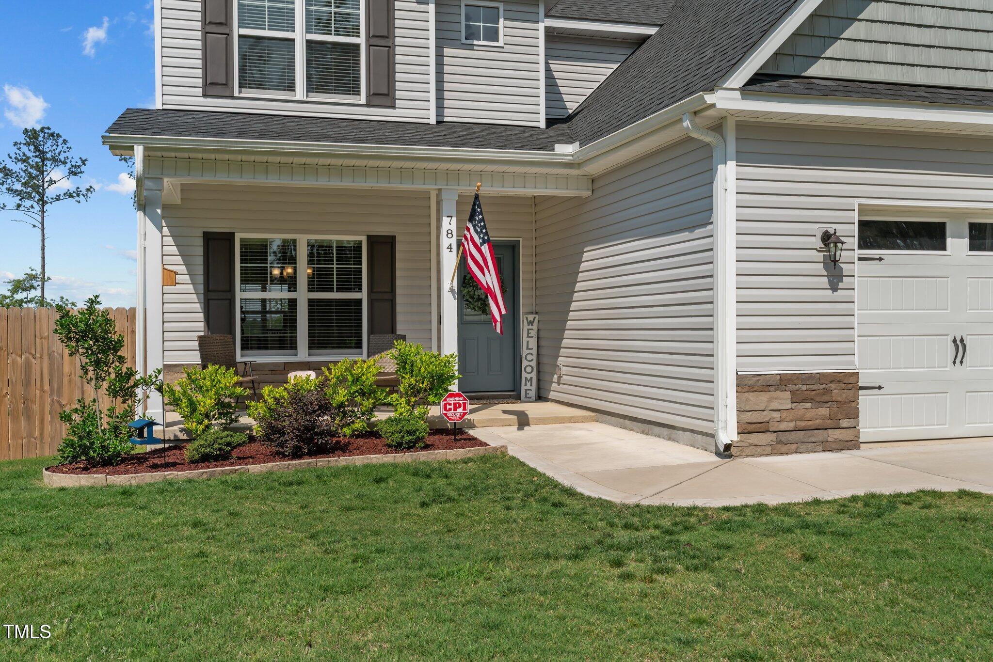 784 Cypress Road Cameron, NC 28326 - Photo 1 of 3 a view of a house with a yard and potted plants