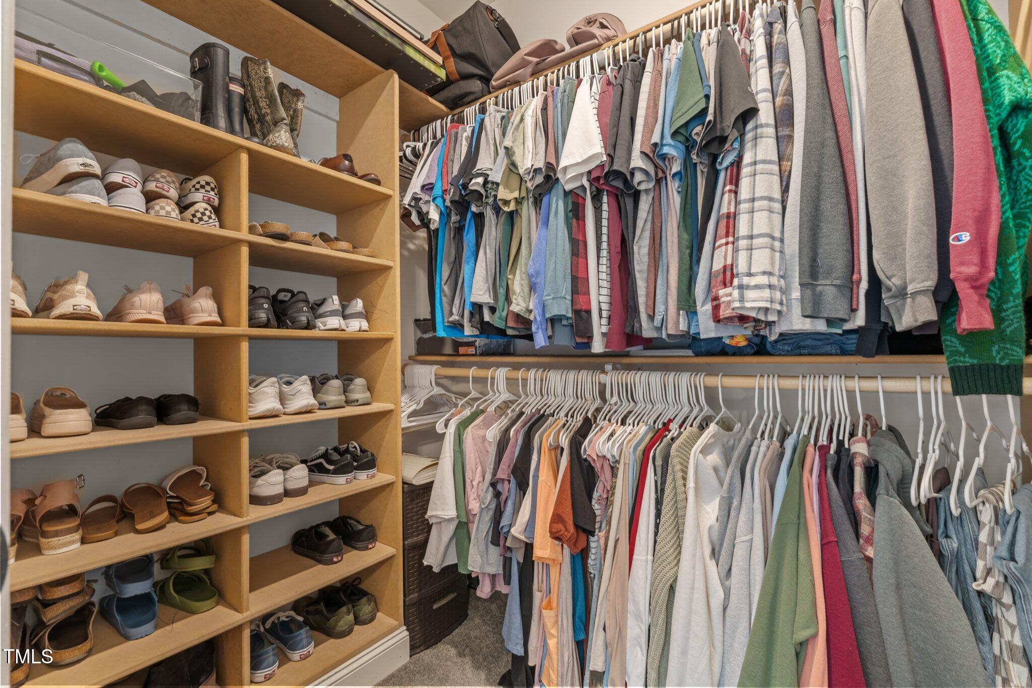 784 Cypress Road Cameron, NC 28326 - Photo 3 of 3 a view of walk in closet with clothes and shoes