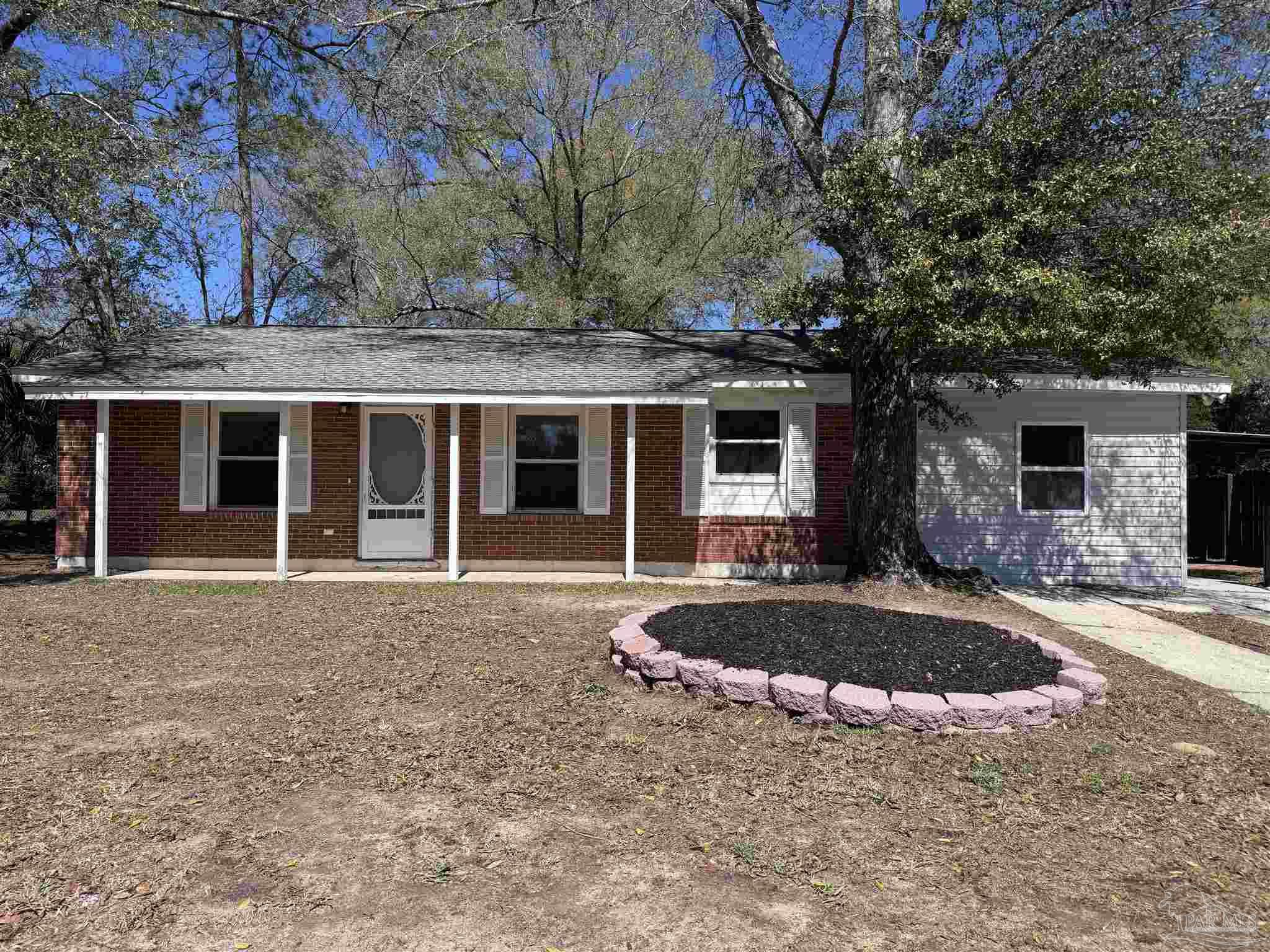 6426 Walnut Street Milton, FL 32570 - Photo 1 of 21 front view of a house with a yard
