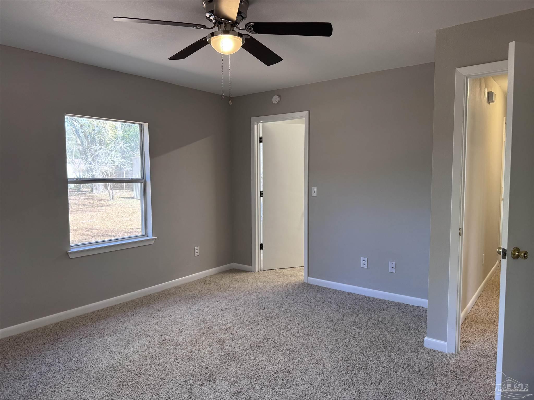 6426 Walnut Street Milton, FL 32570 - Photo 12 of 21 a view of an empty room with a window