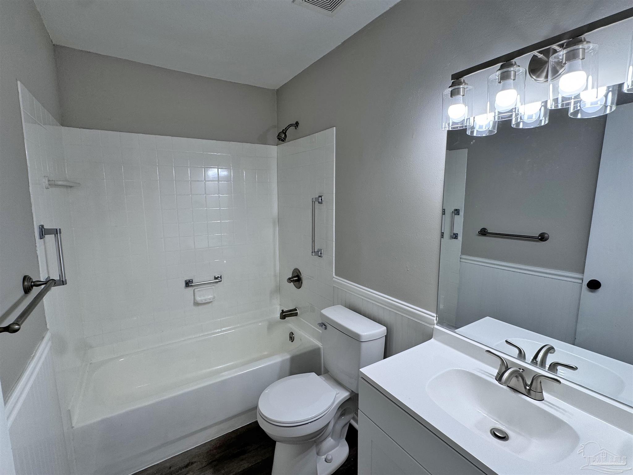 6426 Walnut Street Milton, FL 32570 - Photo 14 of 21 a bathroom with a sink toilet tub and shower