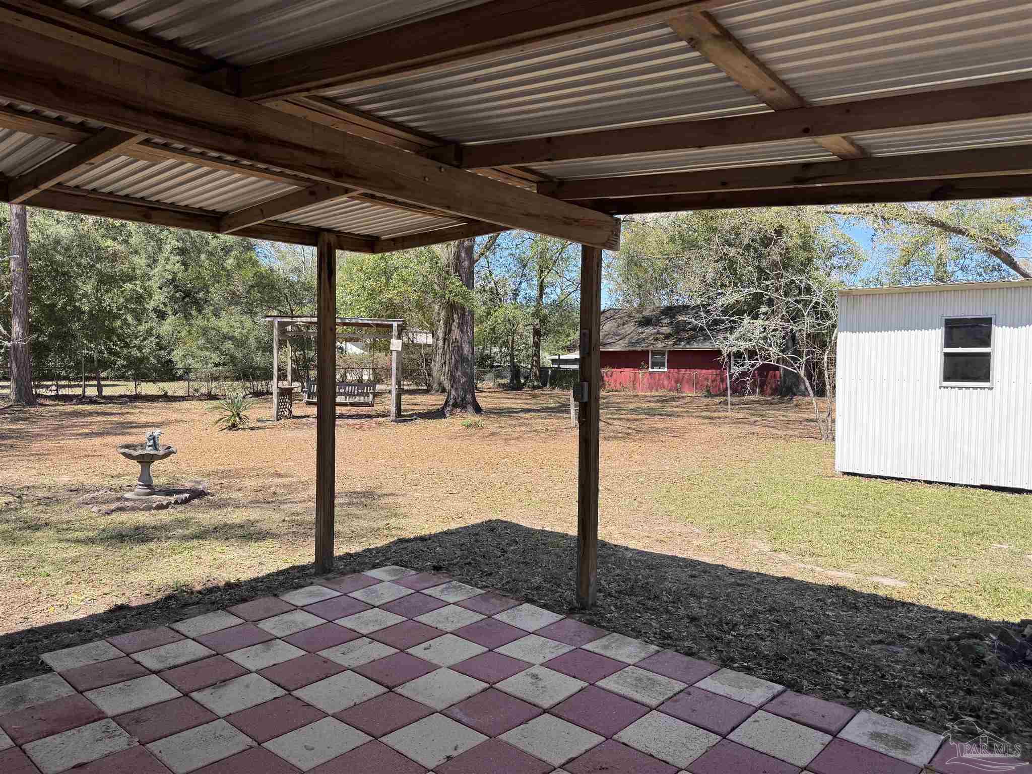 6426 Walnut Street Milton, FL 32570 - Photo 18 of 21 a view of a backyard of a house