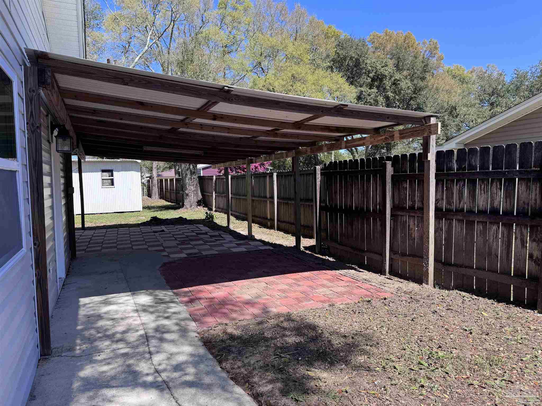 6426 Walnut Street Milton, FL 32570 - Photo 19 of 21 a view of outdoor space with wooden fence
