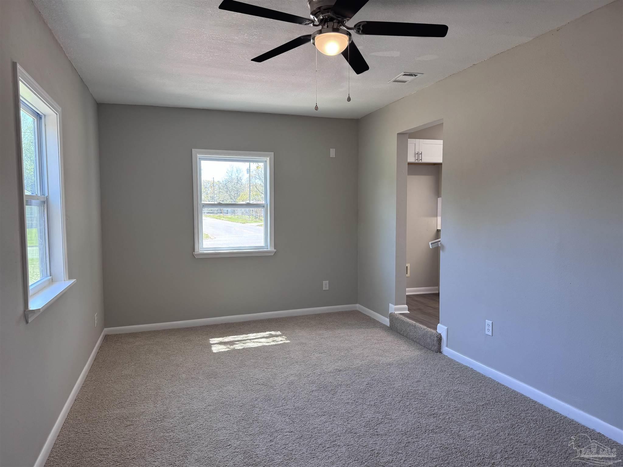 6426 Walnut Street Milton, FL 32570 - Photo 9 of 21 a view of an empty room with a window