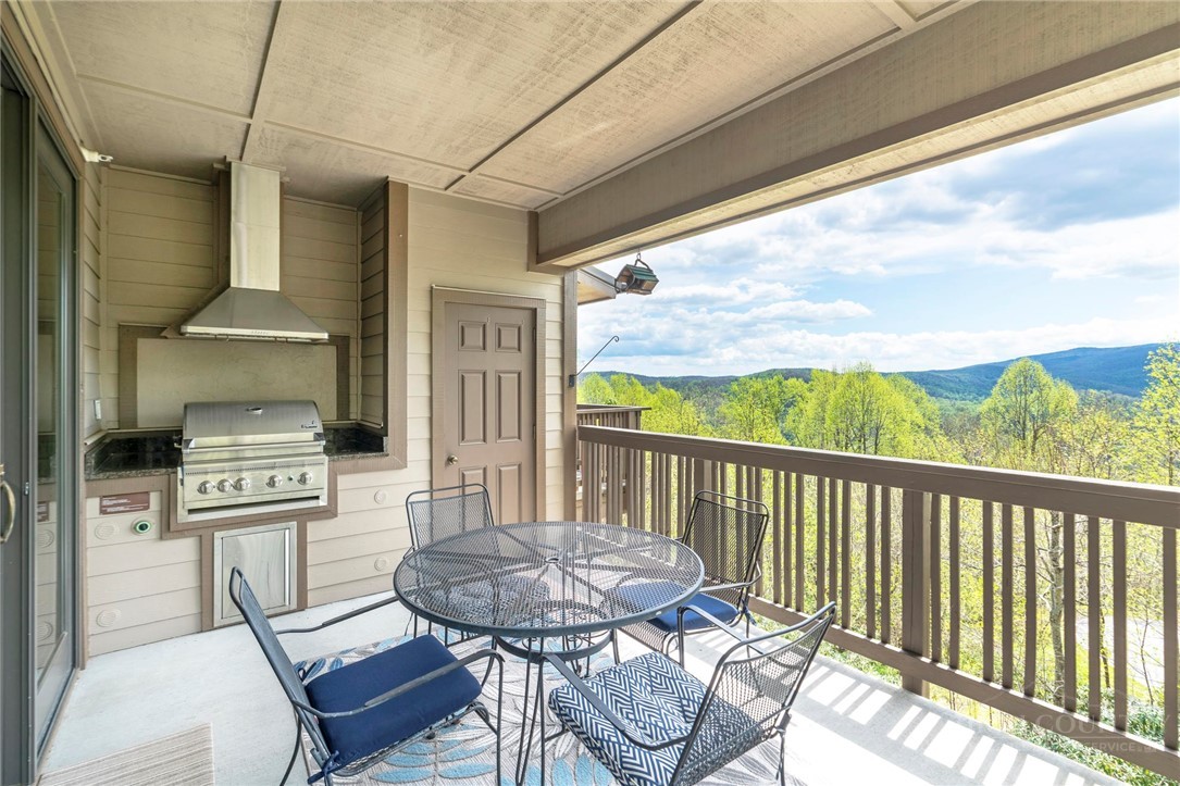 142 Evening View Lane, Unit CA4 Boone, NC 28607 - Photo 13 of 36 a balcony with table and chairs