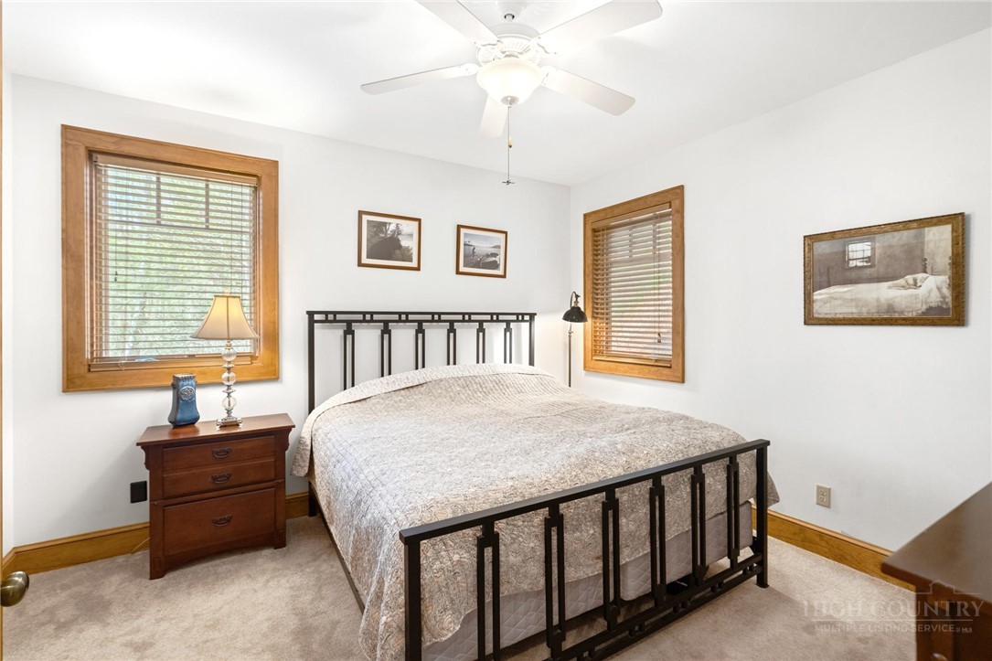 142 Evening View Lane, Unit CA4 Boone, NC 28607 - Photo 20 of 36 a bed room with a bed and a window