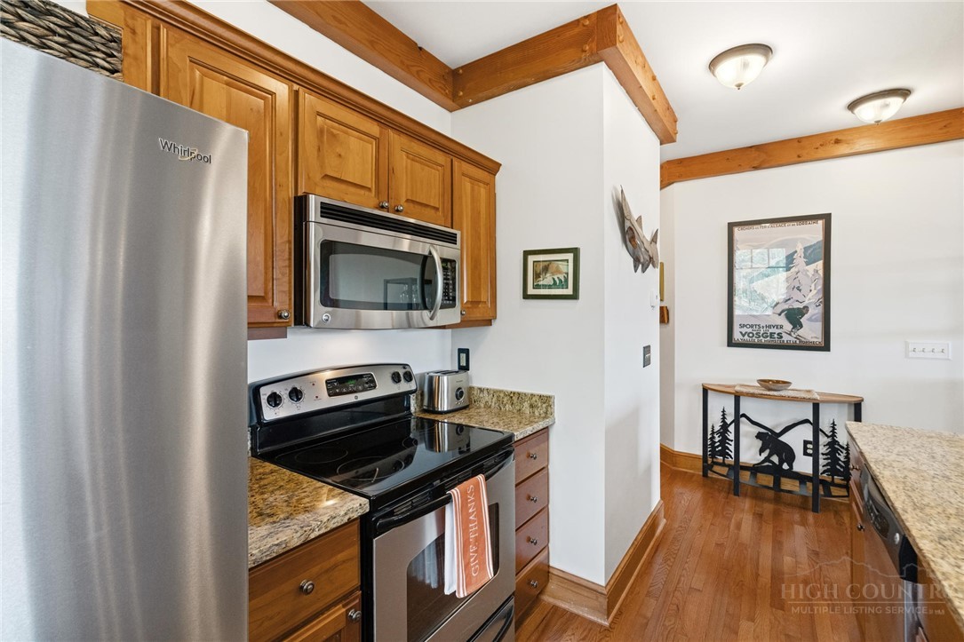 142 Evening View Lane, Unit CA4 Boone, NC 28607 - Photo 7 of 36 a kitchen with stainless steel appliances granite countertop a stove a microwave and a refrigerator