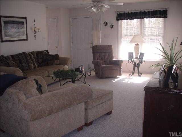 4201 Cheek Road Durham, NC 27704 - Photo 5 of 8 a living room with furniture and a large window