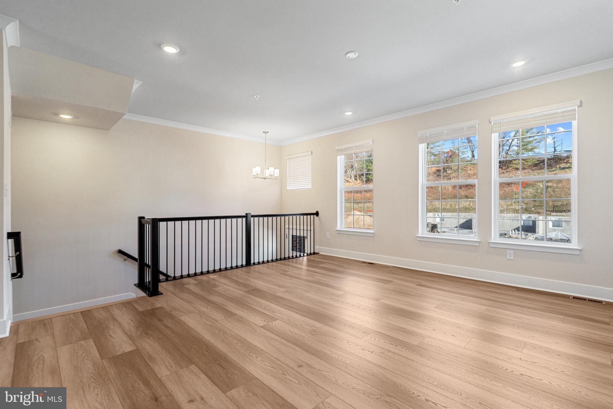 1730 Water Xing Road Baltimore, MD 21208 - Photo 6 of 33 wooden floor in an empty room with a window