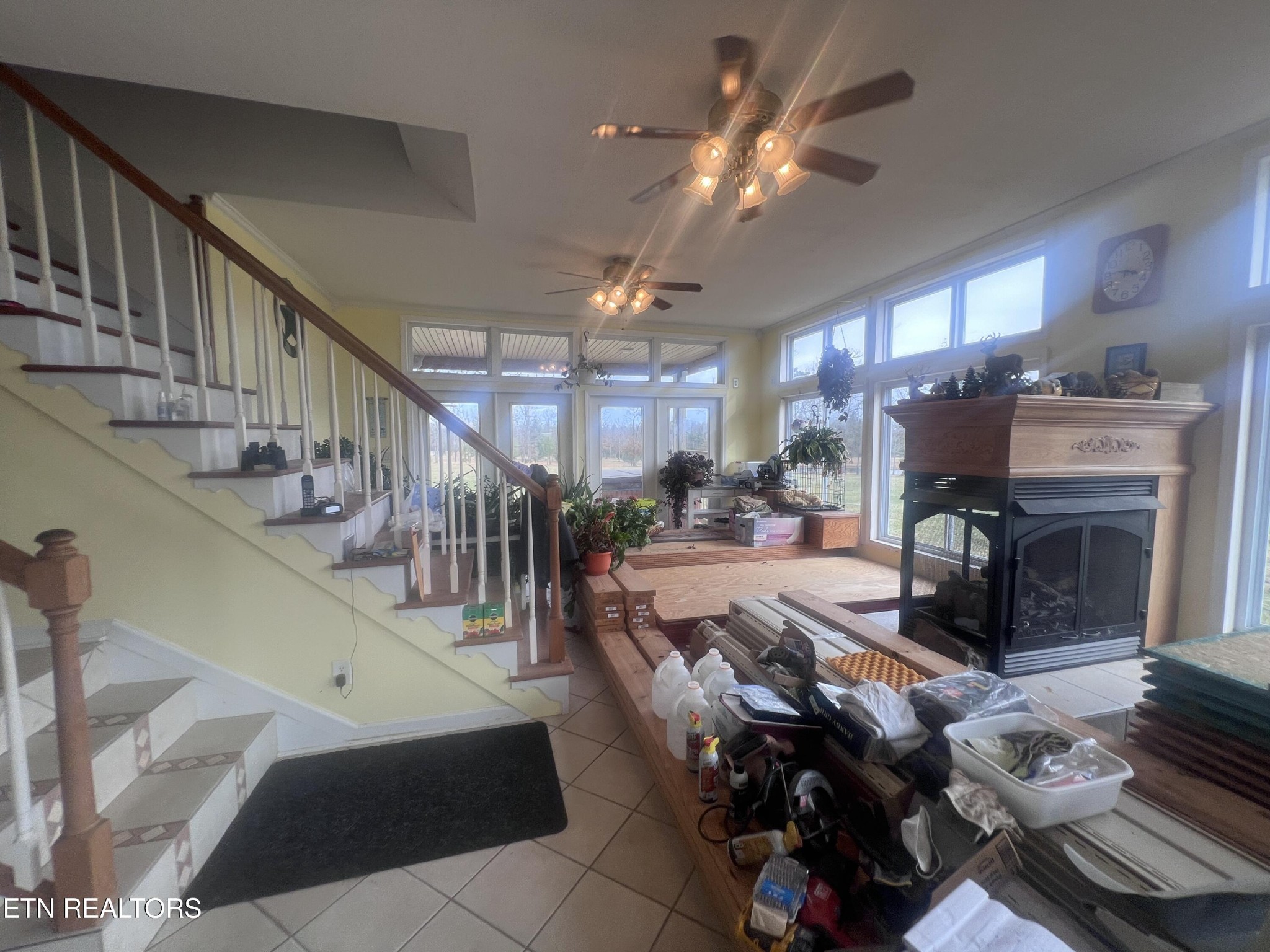 1275 Twin Bridge Road Deer Lodge, TN 37726 - Photo 32 of 47 a living room with fireplace furniture and a chandelier