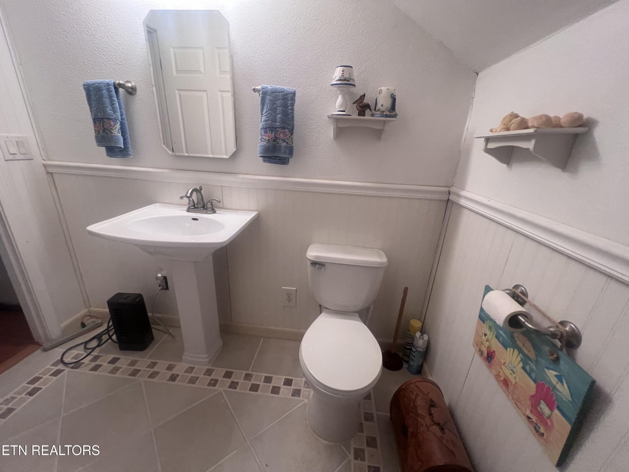 1275 Twin Bridge Road Deer Lodge, TN 37726 - Photo 37 of 47 a bathroom with a sink toilet and mirror