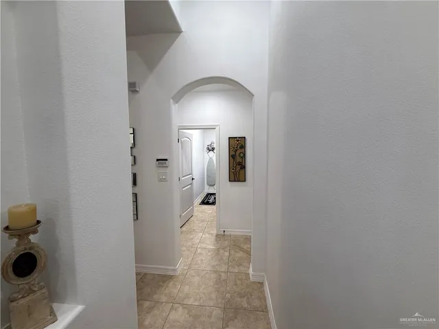 a living room with furniture and flowers