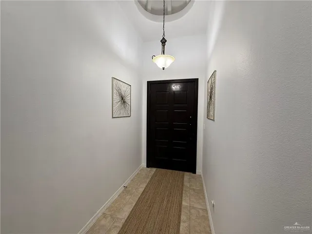 a view of a hallway with closet area
