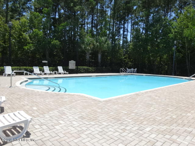 7920 Merrill Road, Unit 1013 Jacksonville, FL 32277 - Photo 11 of 11 a view of a swimming pool with a yard