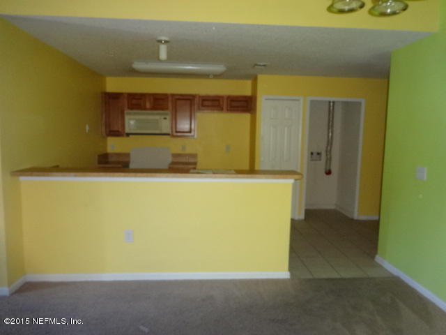 7920 Merrill Road, Unit 1013 Jacksonville, FL 32277 - Photo 6 of 11 a utility room with a sink