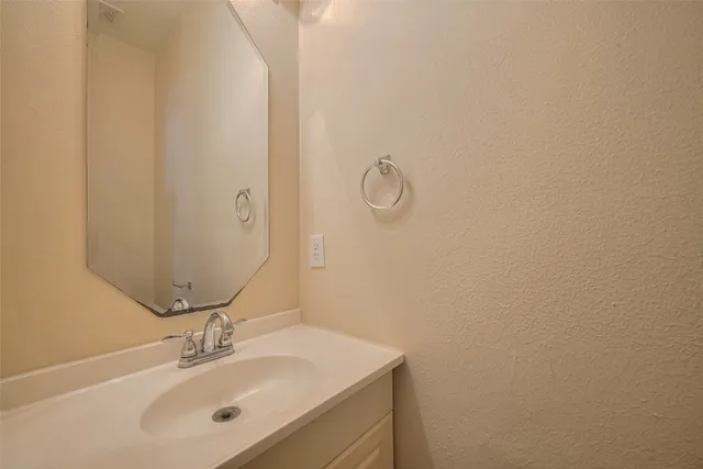 a bathroom with a sink and mirror