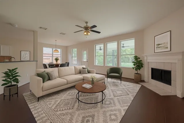 a living room with furniture potted plant and a fireplace