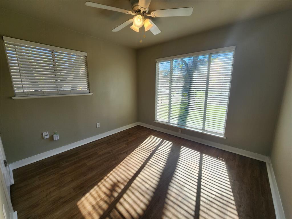 2708 St Edwards Circle, Unit A Austin, TX 78704 - Photo 7 of 13 Unfurnished room with dark wood finished floors and ceiling fan