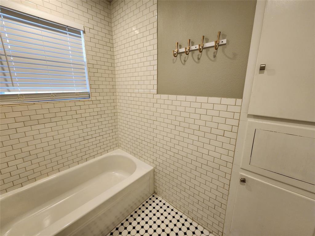 2708 St Edwards Circle, Unit A Austin, TX 78704 - Photo 10 of 13 Full bath featuring tile walls and tile patterned flooring
