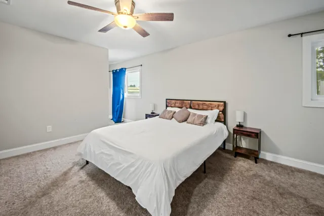 a bedroom with a bed and window