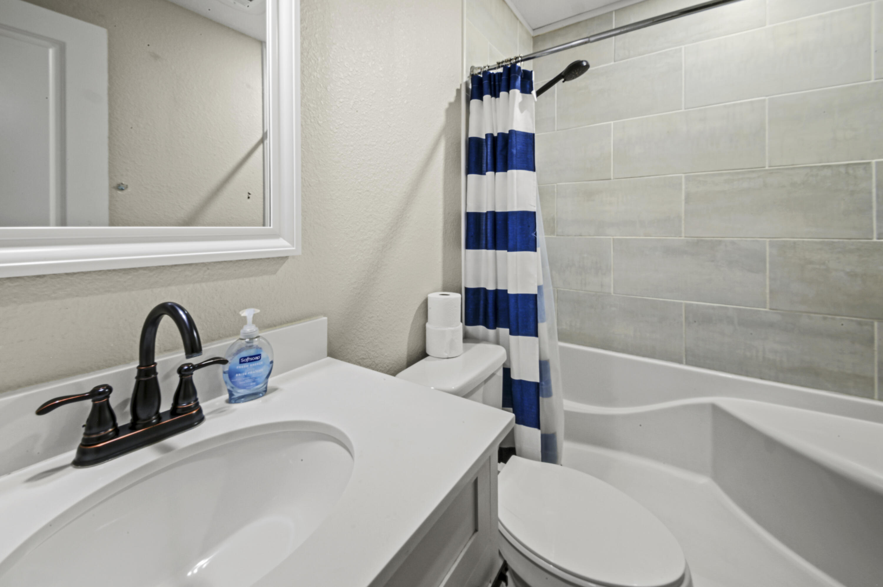 23 East Brainerd Street Pensacola, FL 32501 - Photo 12 of 25 a bathroom with a sink a toilet and shower