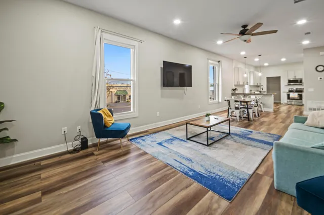 a view of a dining room with furniture window and wooden floor