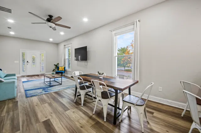 a bedroom with a bed and a ceiling fan