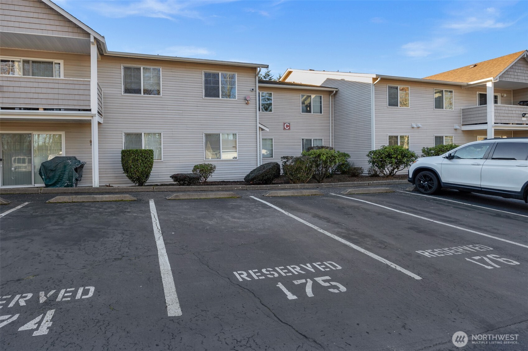 1001 West Casino Road, Unit A303 Everett, WA 98204 - Photo 27 of 28 a view of a car parked in front of a building