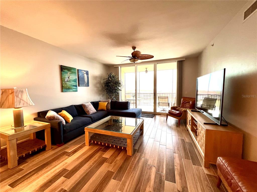 3313 Sunset Key Circle, Unit 404 Punta Gorda, FL 33955 - Photo 11 of 49 a living room with furniture and a flat screen tv