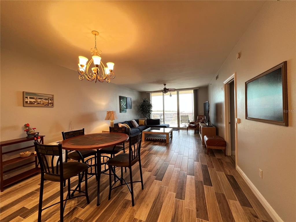 3313 Sunset Key Circle, Unit 404 Punta Gorda, FL 33955 - Photo 12 of 49 a view of a dining room with furniture and wooden floor