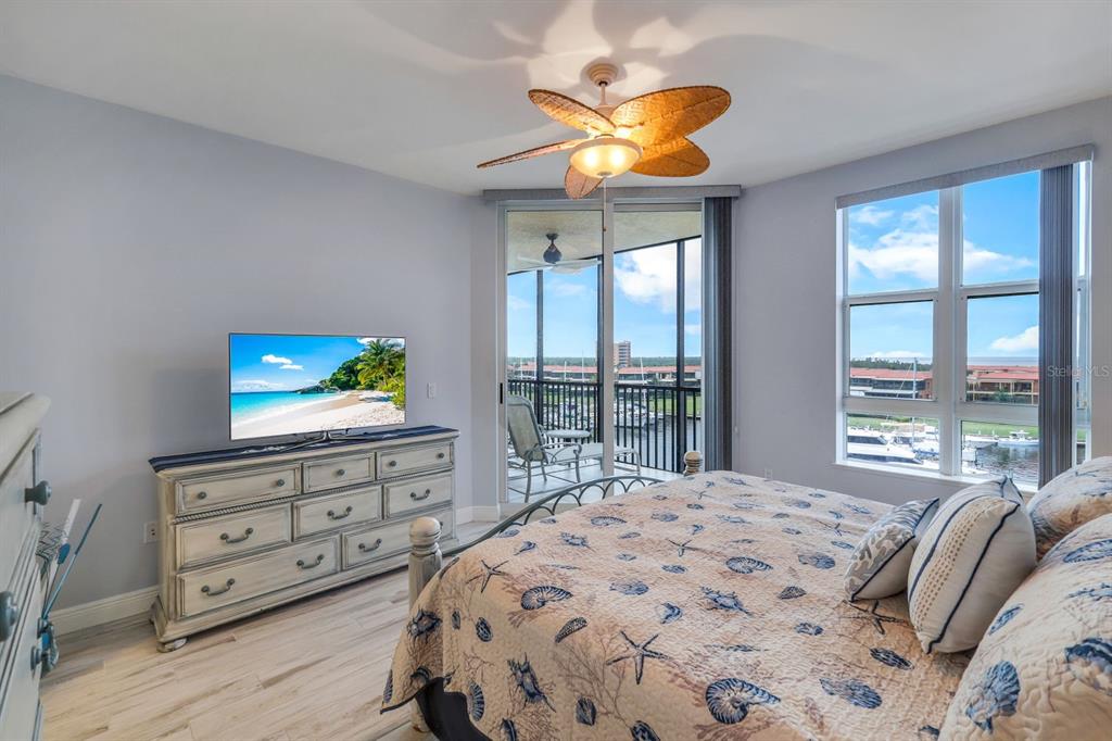 3313 Sunset Key Circle, Unit 404 Punta Gorda, FL 33955 - Photo 15 of 49 a bedroom with a bed and a television