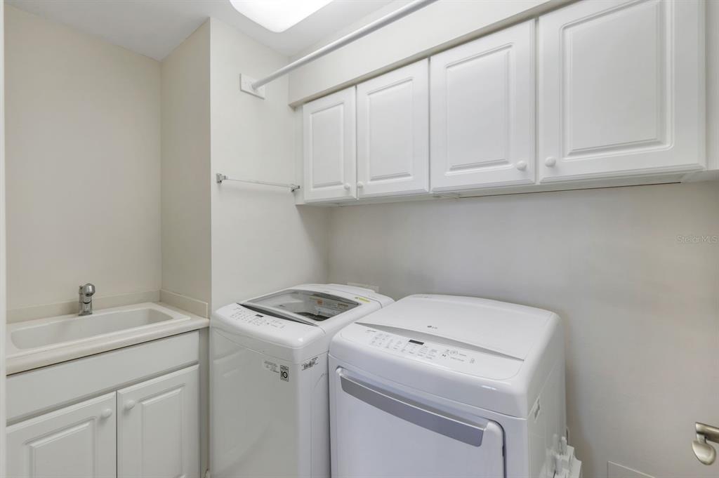 3313 Sunset Key Circle, Unit 404 Punta Gorda, FL 33955 - Photo 20 of 49 a utility room with dryer and washer