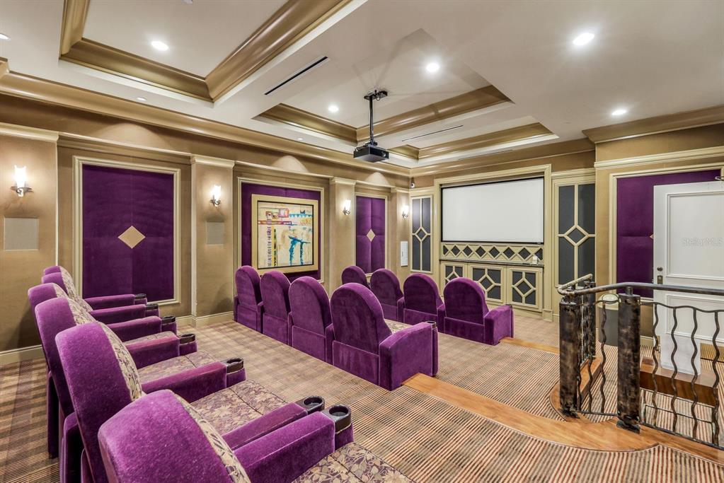 3313 Sunset Key Circle, Unit 404 Punta Gorda, FL 33955 - Photo 24 of 49 a media room with lots of chairs and a projector