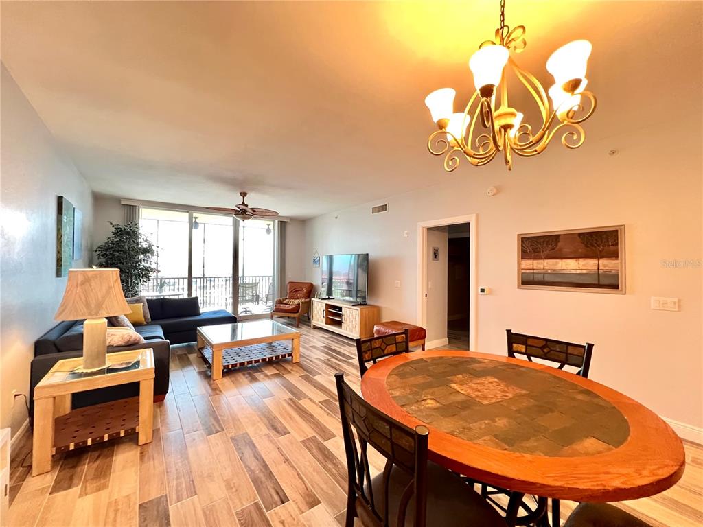 3313 Sunset Key Circle, Unit 404 Punta Gorda, FL 33955 - Photo 10 of 49 a living room with dining table and chairs